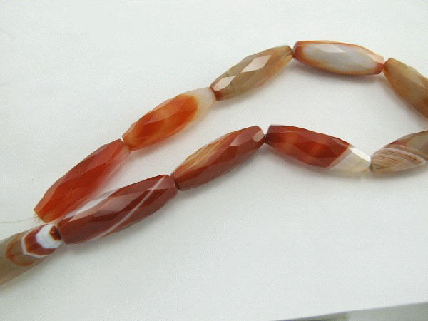 Design 6064: brown, yellow, red, red, mixed botswana agate faceted beads