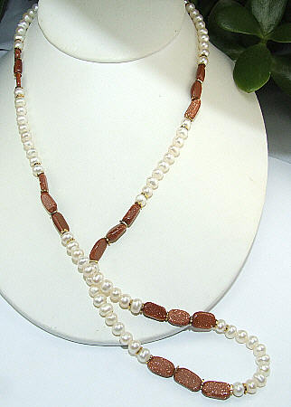 Design 6486: brown,white pearl necklaces