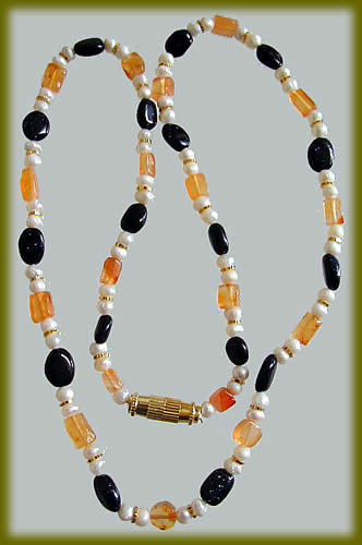 Design 858: orange,white,black carnelian necklaces